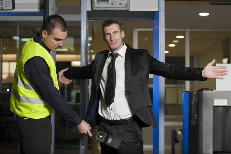 A security person checking a men